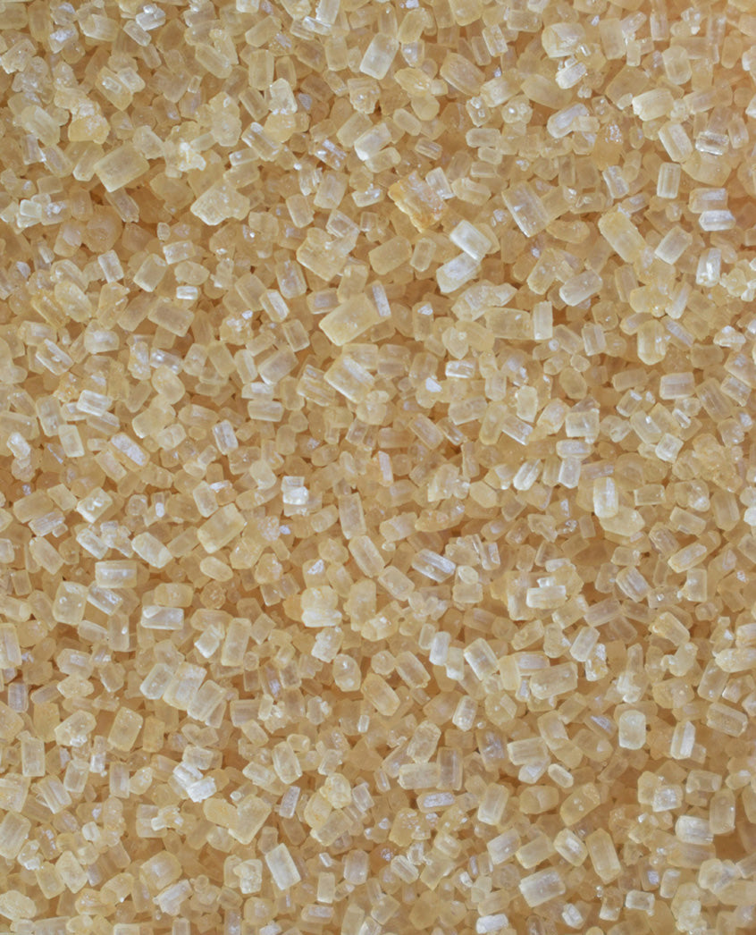 Macro close-up of raw sugar crystals