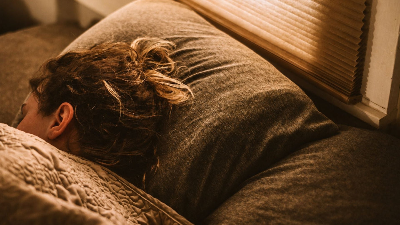 Exhausted woman sleeping for an article on extreme fatigue after migraine 