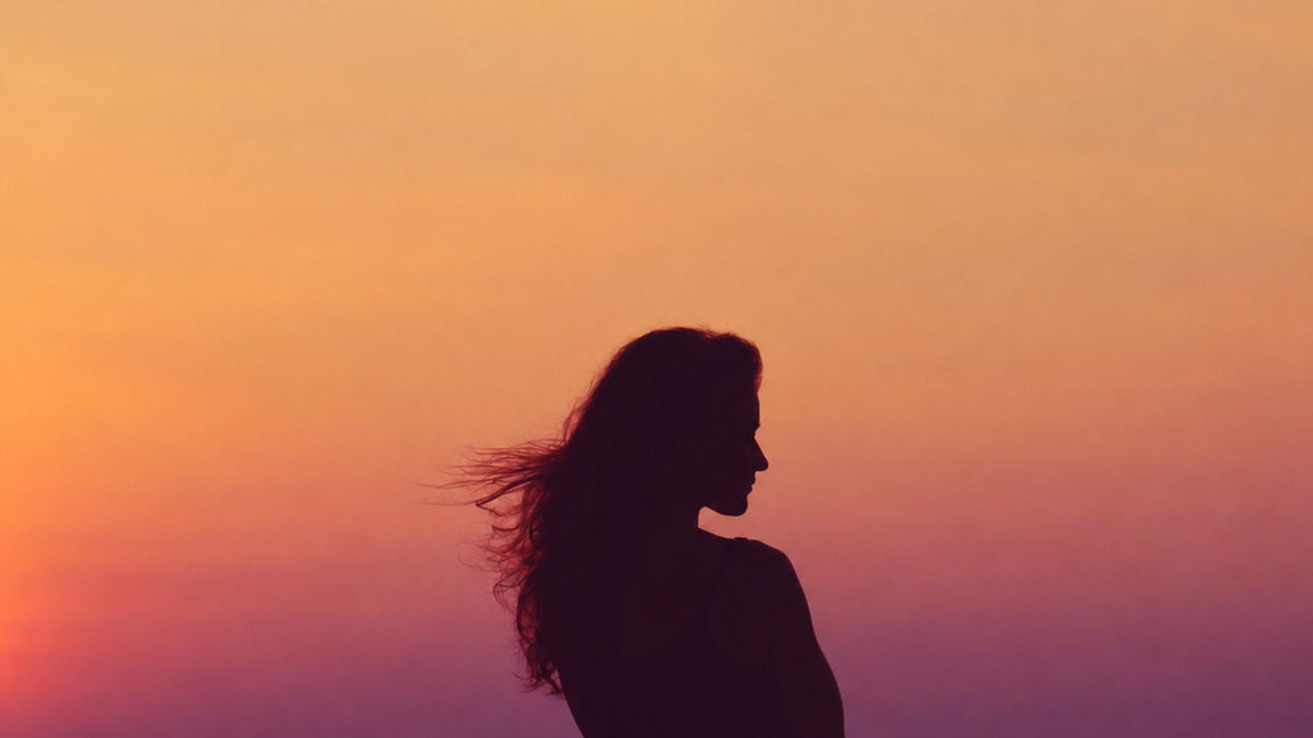 woman in shadow representing aura migraine 