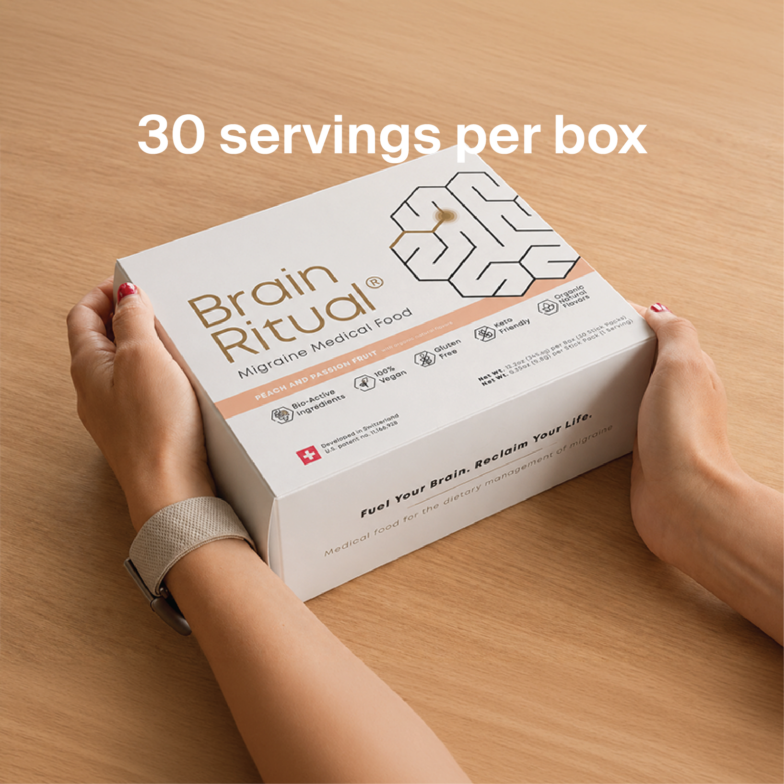 Hands holding a Brain Ritual Migraine Medical Food box. Image text reads: 30 servings per box.