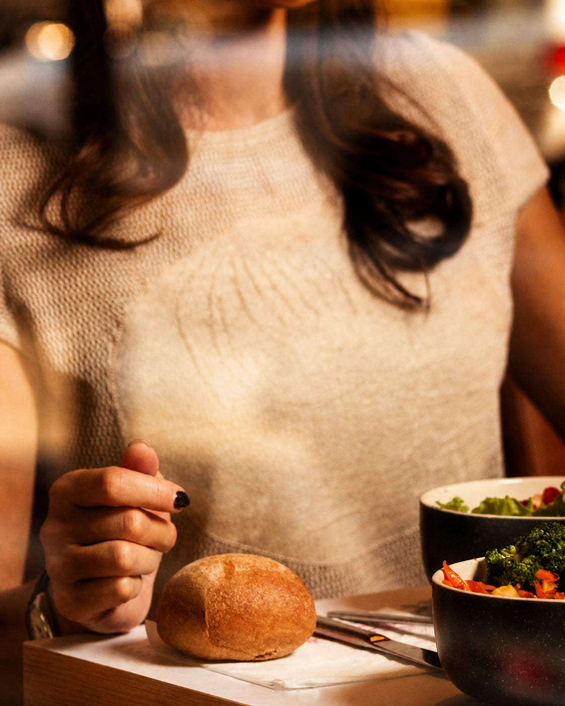 Woman eating a meal at a table