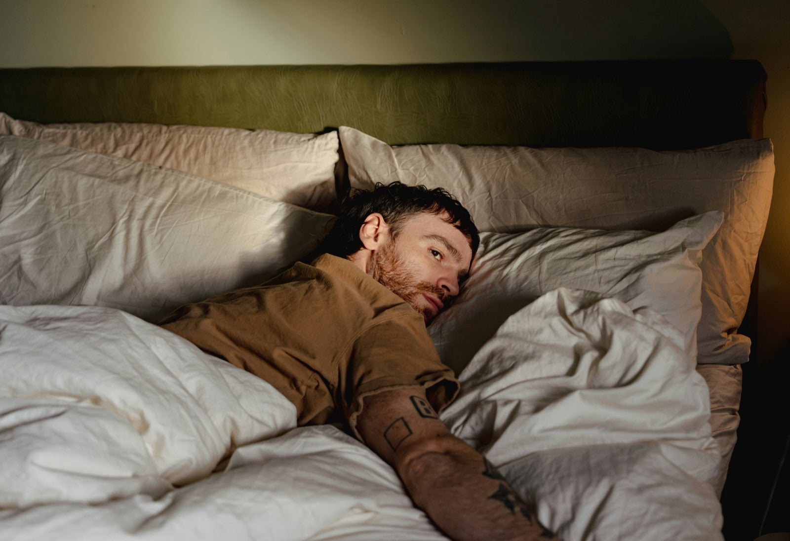 Person lying awake in bed